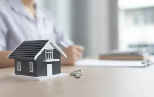 Miniature-house-symbolising-the-secure-and-caring-atmosphere-of-a-Children's-Care-Home