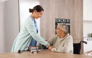 Residential-Care-nurse-checking-an-elderly-woman’s-blood-pressure