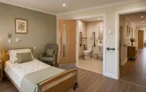 C2-Care-Home-Conversion-interior-upgrade-featuring-an-accessible-bedroom-with-wide-doorways-safety-features-and-a-warm-residential-care-environment