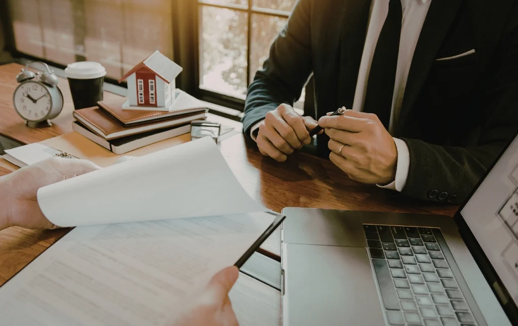 C2-Conversions-Businessman-holding-documents-and-discussing