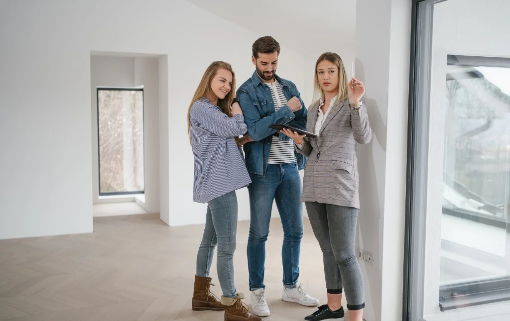 C2-Conversions-Residential-building-with-two-people-and-tablet