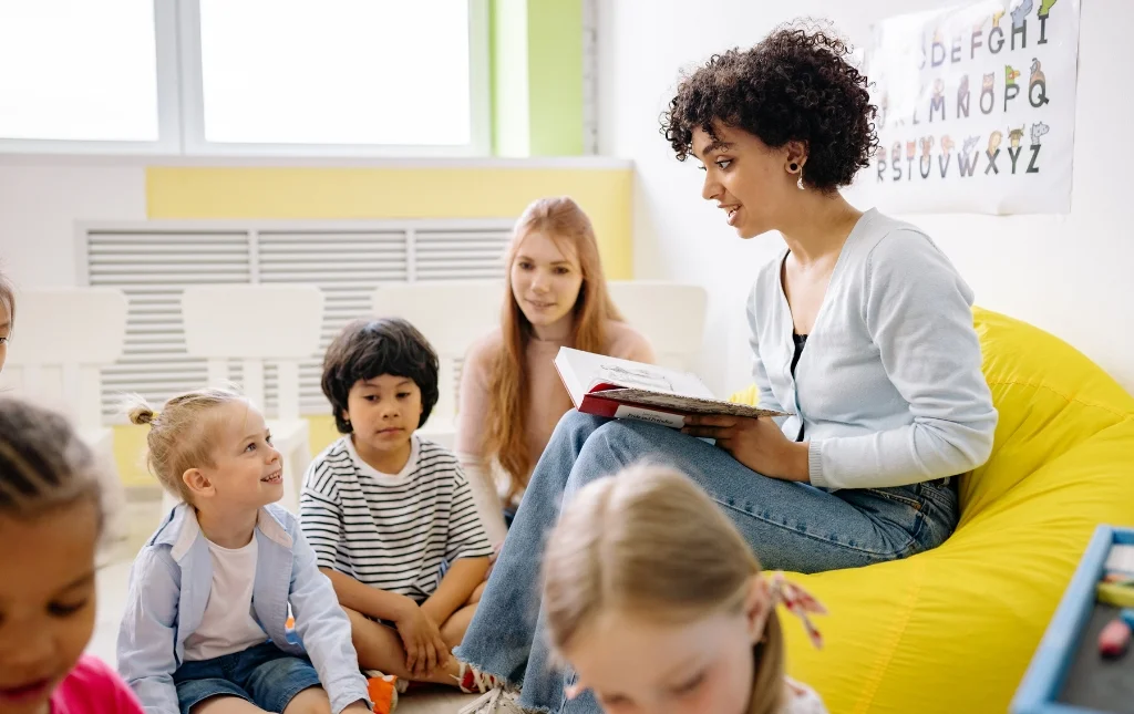 C2-Conversions-Teacher-reading-to-children-in-classroom